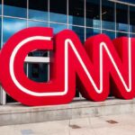 CNN Scrambles After Embarrassing Obituary Blunder CNN red logo sculpture outside a modern glass building