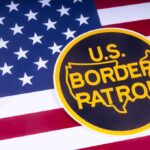 ICE Snatches Illegal Who Drowned Toddler U.S. Border Patrol emblem on American flag