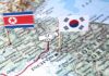 Map of Korean Peninsula with North and South Korean flags and handshake icon