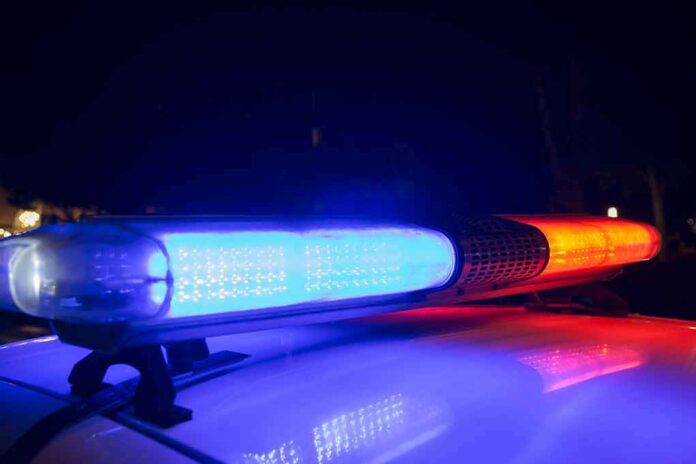shutterstock_1168252924-1 Police car light bar flashing blue and red at night