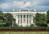 The White House north facade behind a black iron fence