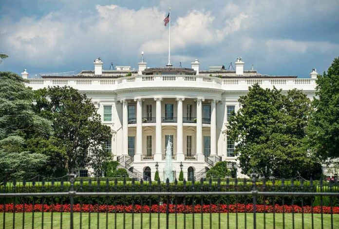 The White House north facade behind a black iron fence