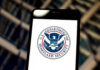 DHS Demands NFL Pulls Controversial Border Video U.S. Department of Homeland Security logo on smartphone.