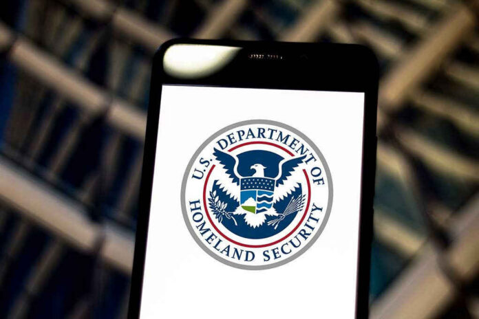1389550511 U.S. Department of Homeland Security logo on smartphone.