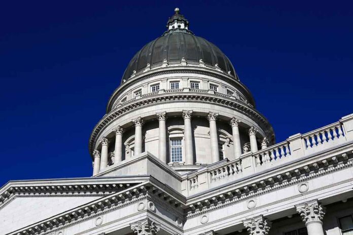 shutterstock_1020176086 Capitol building dome with columns against a deep blue sky