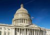 United States Capitol dome against clear blue sky