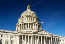 United States Capitol dome against clear blue sky