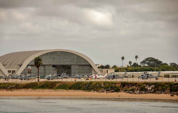 shutterstock_1086141389 airport hangar with helicopters near a shoreline