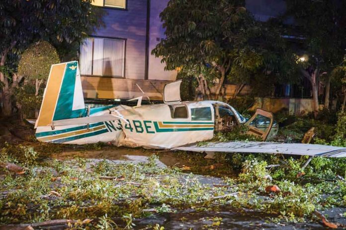 small airplane crash in residential area at night