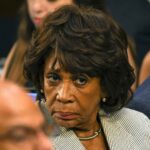 Race Card Hits Media–Dem Civil War Blame woman with serious expression in a crowd