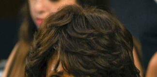 woman with serious expression in a crowd