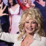 Tennessee Honors Dolly Parton With Touching Tribute blonde woman waving at a red carpet event
