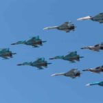 Poland Tells Fighters ‘Shoot Anything That Moves!’ A formation of military jet fighters flying in a clear blue sky