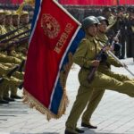 Military parade with soldiers marching; Pham Van Dong, Zhang Jun, Zhang Yufeng, Norichika Aoki, Andreas Hestler, Jonathan Cyprien not visible