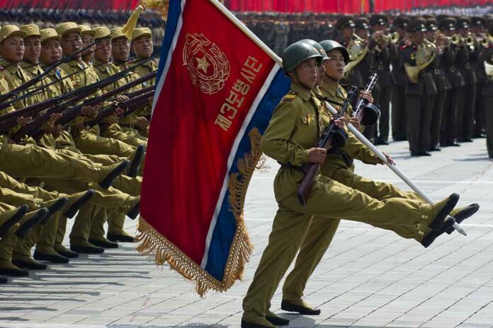Military parade with soldiers marching; Pham Van Dong, Zhang Jun, Zhang Yufeng, Norichika Aoki, Andreas Hestler, Jonathan Cyprien not visible