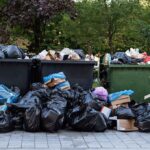 Woman Guilty of Capital Murder – Kills Newborn in Dumpster Overflowing dumpsters with piles of trash bags and cardboard