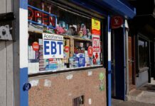 Convenience store window with EBT and ATM signs