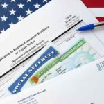 Trumps Quiet Change to Immigration Policy Is a Big Deal immigration forms with green card and social security card on US flag background