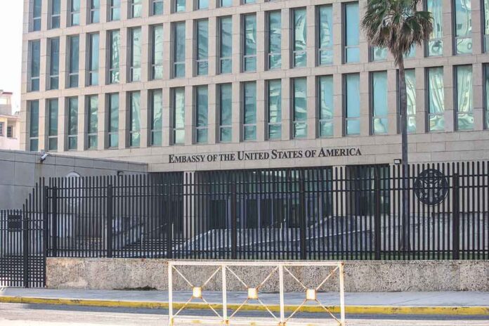 Embassy building behind tall black security fence