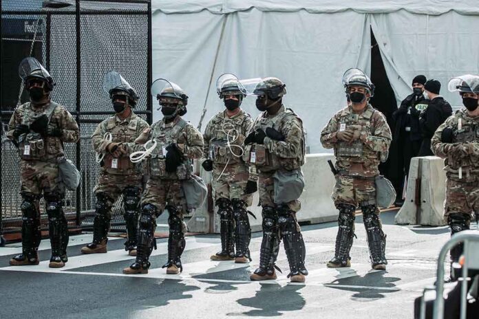 Line of soldiers in riot gear standing on a city street