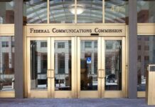 Federal Communications Commission building entrance with gold doors