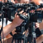 Damning Video Shows How DIRTY MN Elections Really Are television cameras on tripods at a media event