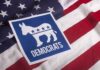 Wacky Dem Nominee Writes Song Hoping Senator Dies Democratic Party donkey symbol on American flag
