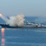Warship launching a missile at sea
