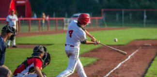 Baseball batter making contact with a pitched ball
