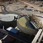 Industrial water treatment tanks at a mining site
