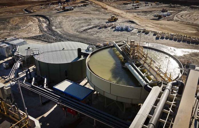 Industrial water treatment tanks at a mining site