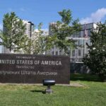 Foreign U.S Citizens Warned: Flights Could Out Vanish Overnight U.S. embassy sign in landscaped grounds