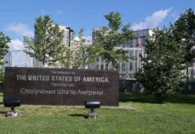 U.S. embassy sign in landscaped grounds