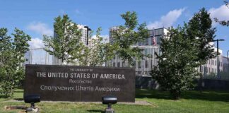 U.S. embassy sign in landscaped grounds