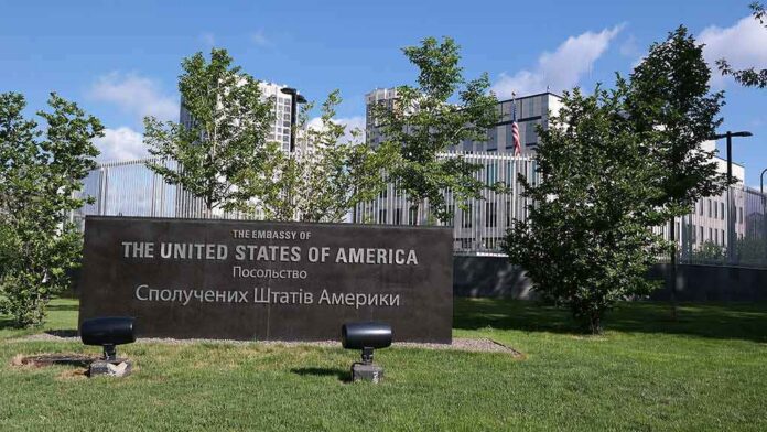 shutterstock_663456193 U.S. embassy sign in landscaped grounds