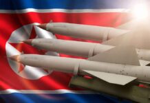Missiles in front of North Korea flag
