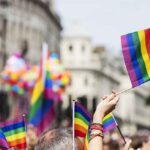 Pride flags waved at a city parade