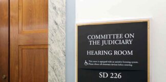 Committee on the Judiciary hearing room sign on wall