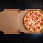 Beloved Pizza Chain Raided in Meth Scandal Pepperoni pizza in an open cardboard box