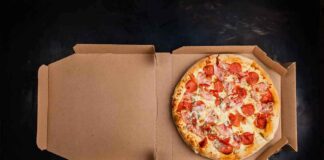 Pepperoni pizza in an open cardboard box