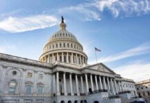 Senator’s Chilling Warning to Trump Hires United States Capitol building under a blue sky