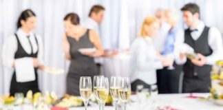 A table set with champagne glasses and desserts at a social event