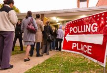 Voters standing in line outside a polling place