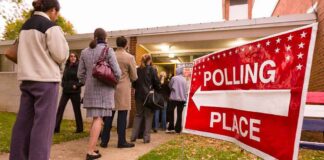 Voters standing in line outside a polling place