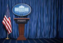 Trump Torches ABC Reporter – Calls Her ‘Not Attractive’ White House press briefing podium with U.S. flag and blue curtain