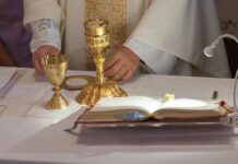 Priests DRAFTED – Sent To The Frontlines Priest at altar with chalices and open book