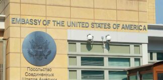 United States Embassy exterior with signage and seal
