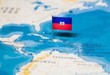 Haiti flag pin on a map of the Caribbean