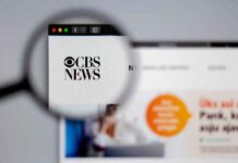 Magnifying glass focusing on CBS News website logo