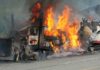 Inferno Engulfs Warehouse, Godfather Church Unscathed Burning semi-truck cab and trailer on highway
